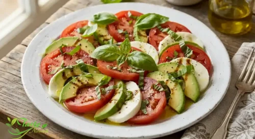 avocado caprese salad recipe garnished with fresh basil and olive oil----