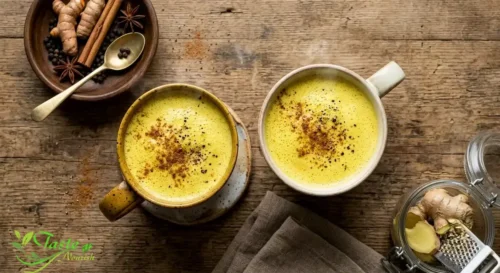 Overhead view of classic golden milk from scratch in two mugs