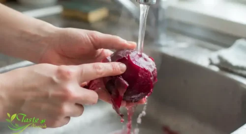 warm boiled beet by hand under running water