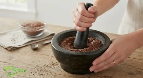 Grinding flax seeds by hand with a mortar and pestle