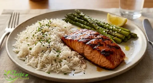 Maple salmon plated with rice and roasted asparagus for dinner